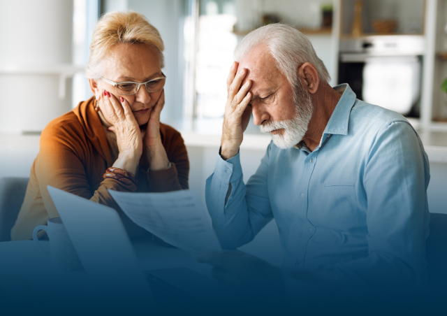 man and woman looking at papers